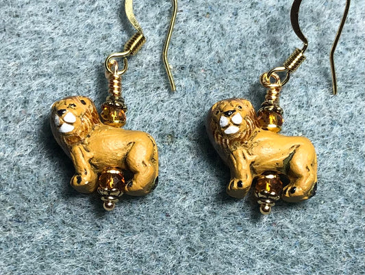 Tiny amber ceramic lion bead earrings adorned with amber Chinese crystal beads.