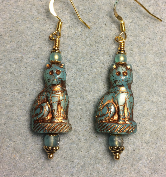 Light turquoise (with copper inlay) fancy Czech glass cat bead earrings adorned with light turquoise Czech glass beads.