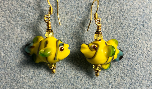 Yellow lamp work fish bead earrings adorned with yellow Chinese crystal beads.