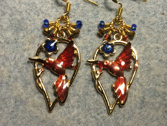 Orange, dark blue, and gold enamel hummingbird charm earrings adorned with tiny dangling orange, dark blue, and gold Chinese crystal beads.