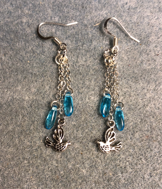Small silver dove charm earrings attached to silver chain and adorned with small turquoise Czech glass dagger beads