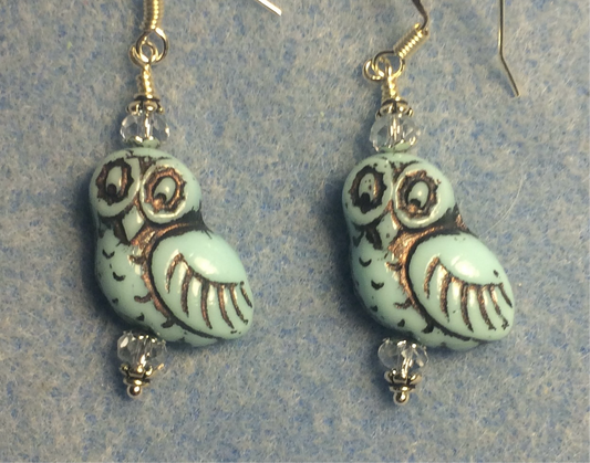 Light aqua (with black wash) fancy Czech glass owl bead earrings adorned with light aqua Chinese crystal beads.