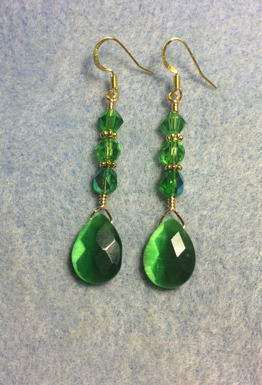 Emerald green fiber optic briolette bead earrings adorned with emerald green Czech glass beads.