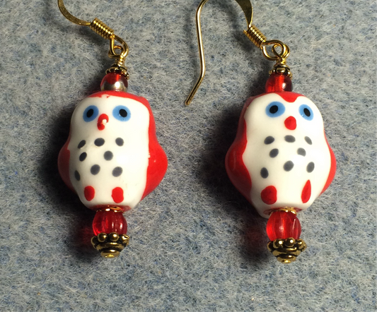 Red and white ceramic spotted owl bead earrings adorned red Czech glass beads.