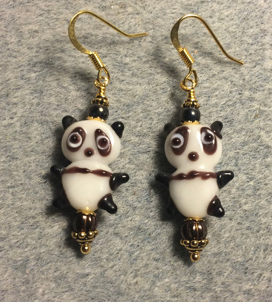 Small brown and white lamp work panda bear bead earrings adorned with brown Chinese crystal beads.