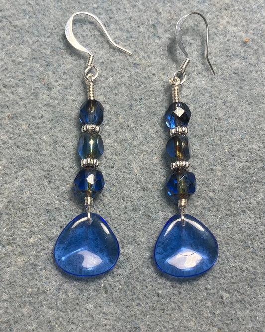 Translucent dark blue Czech glass rose petal earrings adorned with dark blue Czech glass beads.