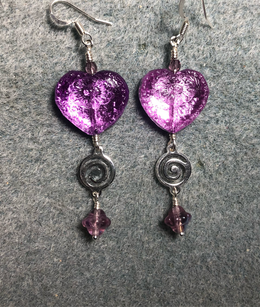 Sparkly violet Czech glass heart bead earrings adorned with silver swirly links and violet Czech glass Saturn beads.