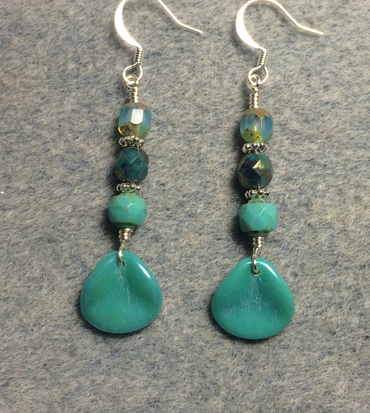Opaque turquoise Czech glass rose petal earrings adorned with turquoise Czech glass beads.