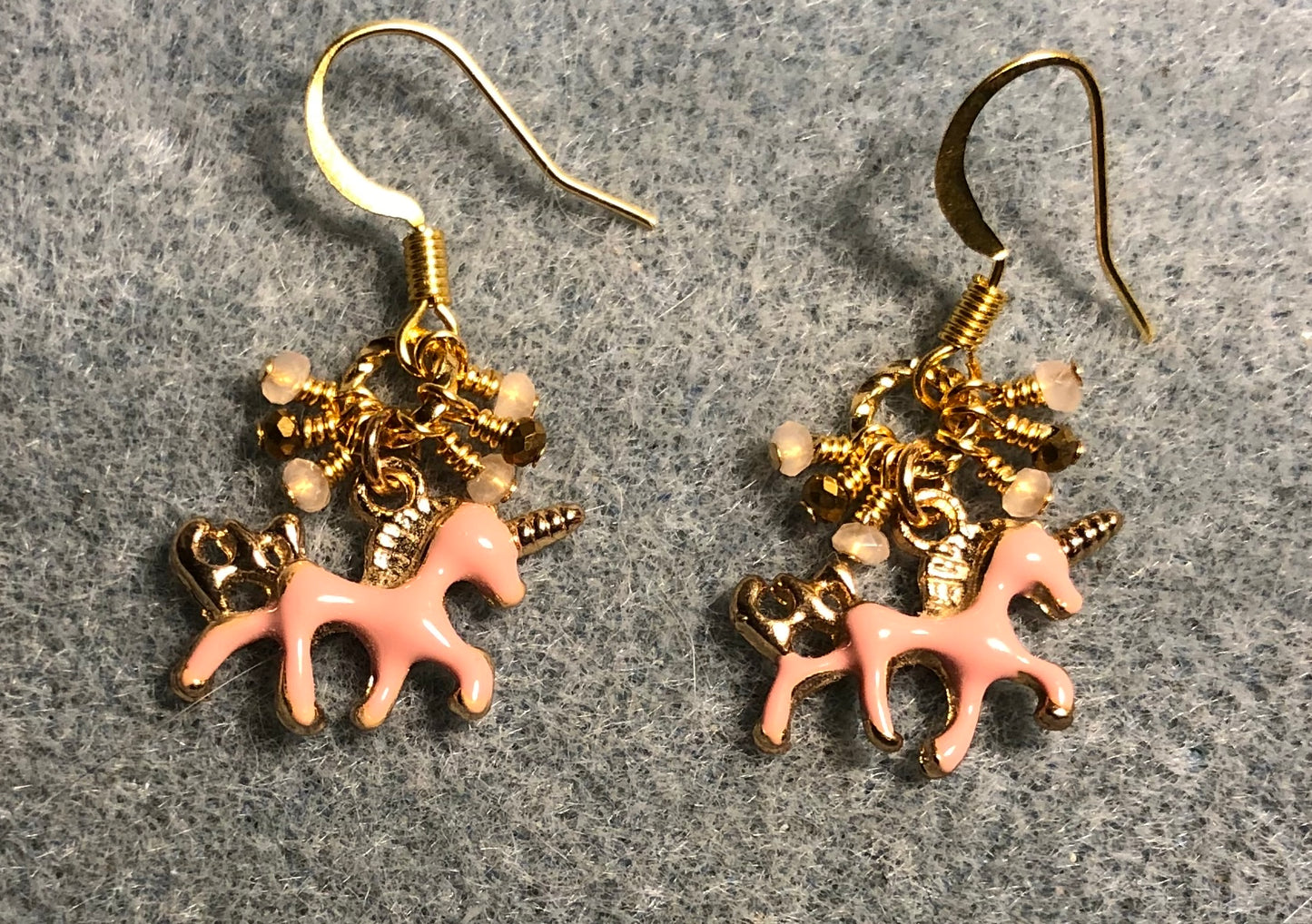 Tiny pink and gold enamel unicorn charm earrings adorned with tiny dangling peach, pink, and gold Chinese crystal beads.