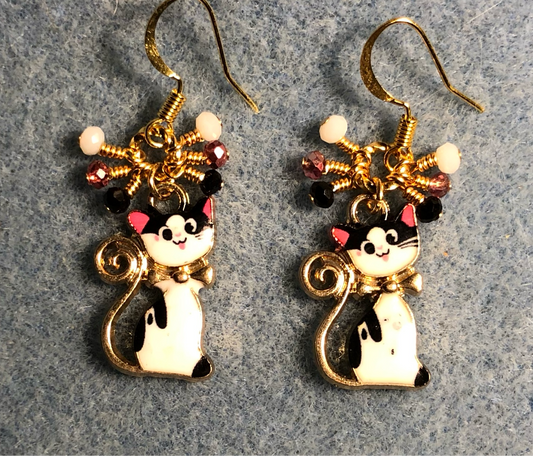 Black, white, and pink enamel cat charm earrings adorned with small dangling black, white, and pink Chinese crystal beads.