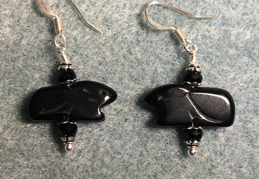 Black onyx gemstone Zuni rabbit bead earrings adorned with black Chinese crystal beads.