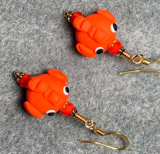 Orange and white polymer clay goldfish bead earrings adorned with orange Chinese crystal beads.