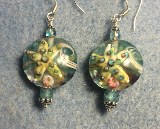Light aqua and tan lamp work starfish bead earrings adorned with light aqua Czech glass beads.