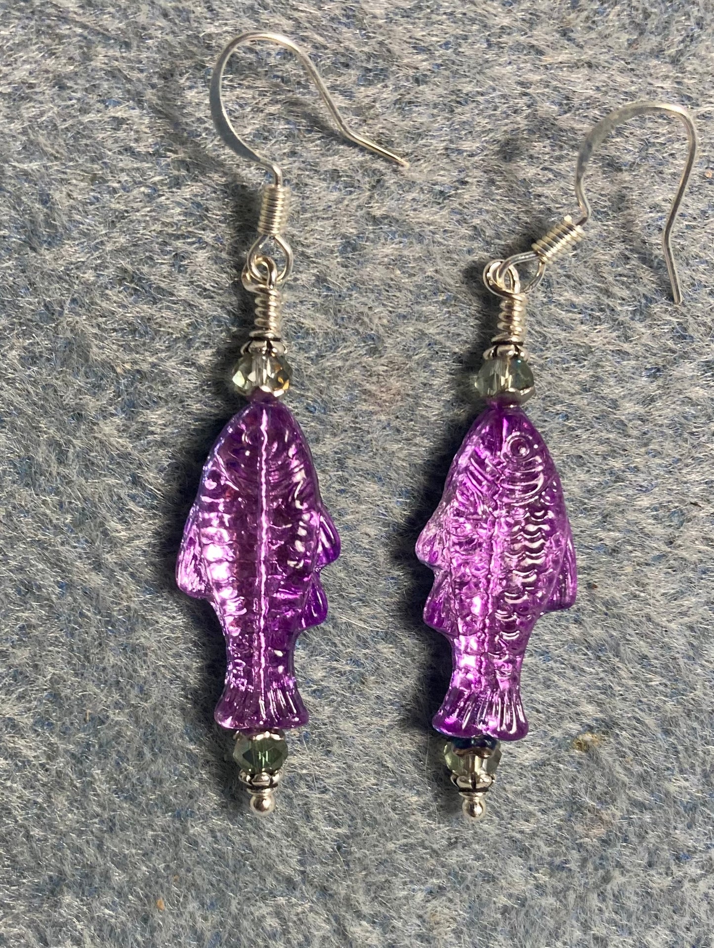 Shimmery purple Czech glass fish bead earrings adorned with purple Chinese crystal beads.