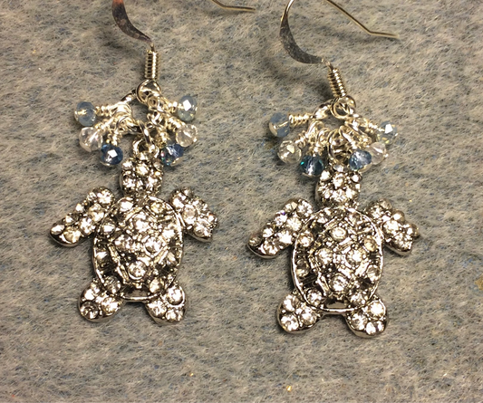 Silver and clear rhinestone turtle charm earrings adorned with tiny dangling light blue and silver Chinese crystal beads.