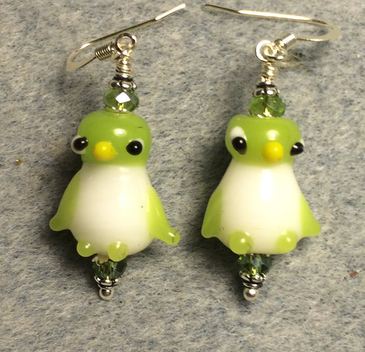 Opaque lime green and white lamp work penguin bead earrings adorned with lime green Chinese crystal beads.