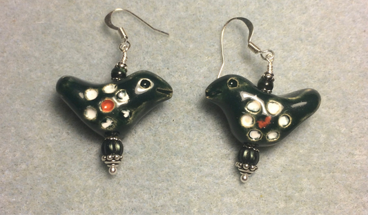 Medium dark green and white ceramic songbird bead earrings adorned with dark green Czech glass beads.