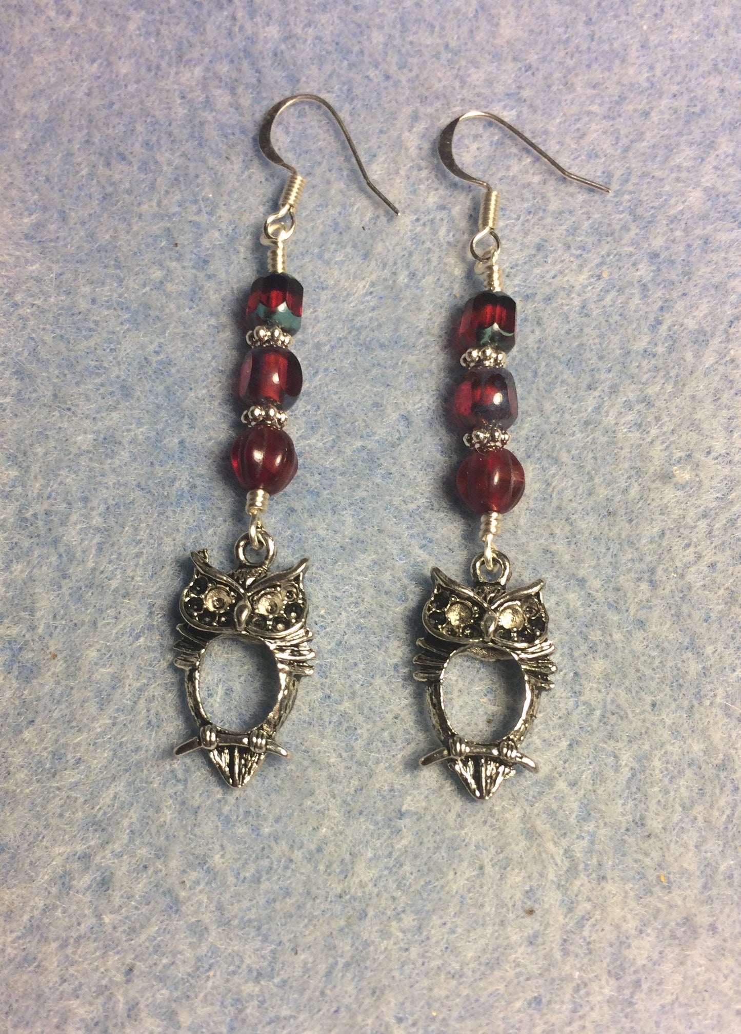 Silver owl charm earrings adorned with ruby red Czech glass beads