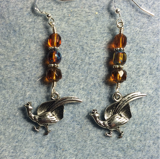 Silver pheasant charm earrings adorned with amber Czech glass beads
