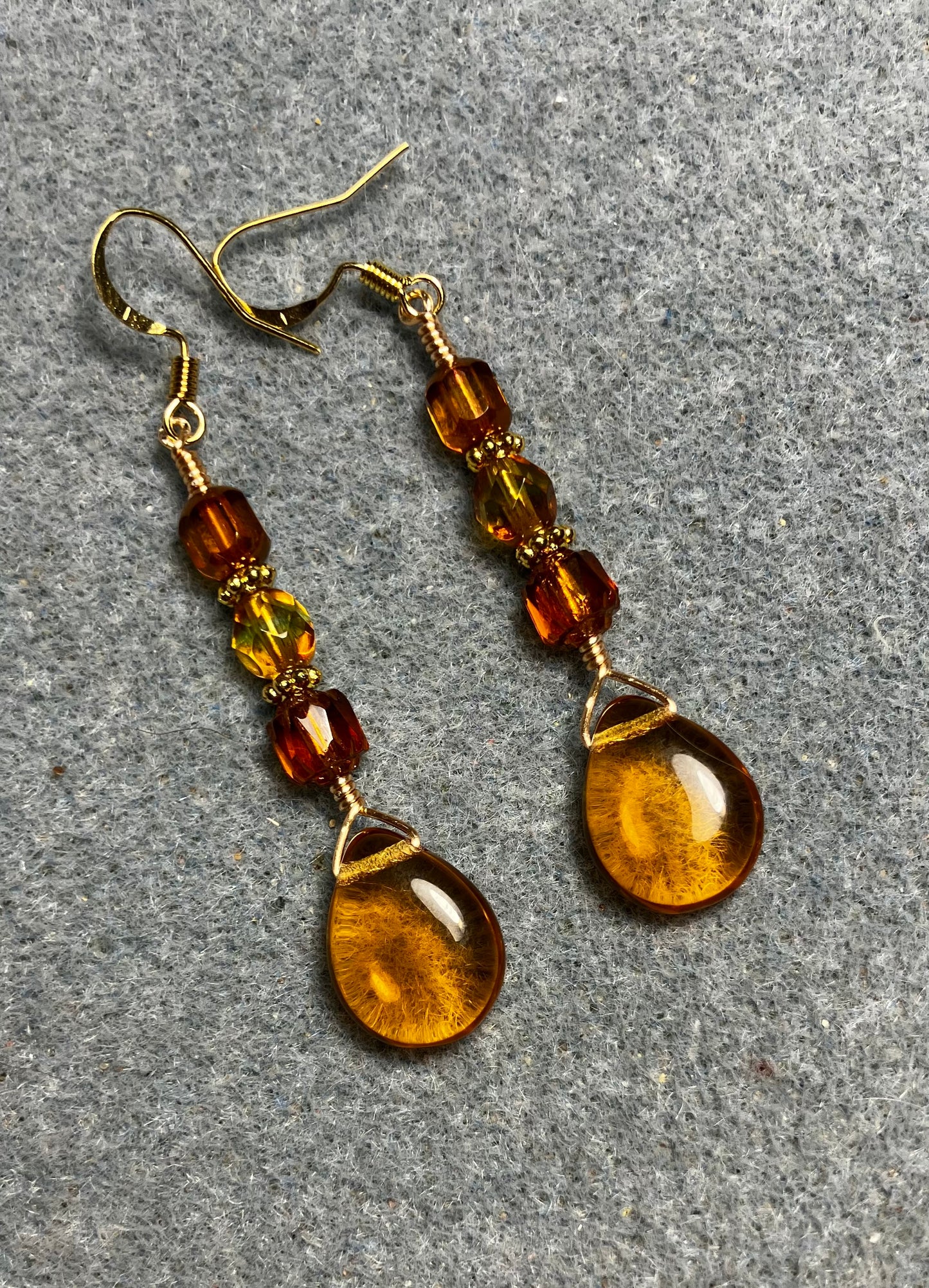 Amber Czech glass pear drop bead earrings adorned with  amber Czech glass beads.
