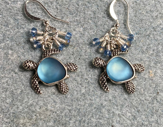 Silver and light blue fiber optic turtle charm earrings adorned with tiny dangling light blue and silver Chinese crystal beads.