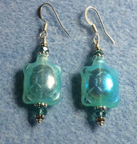 Iridescent turquoise Czech glass turtle bead earrings adorned with turquoise Chinese crystal beads.