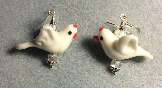 White lamp work flying bird bead earrings adorned with clear Czech glass beads.