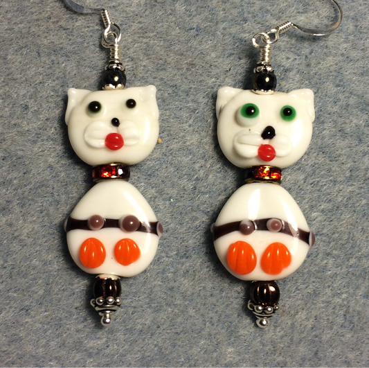 White, brown, and orange lamp work cat bead earrings adorned with orange rhinestone rondelle “collars” and brown Czech glass beads.