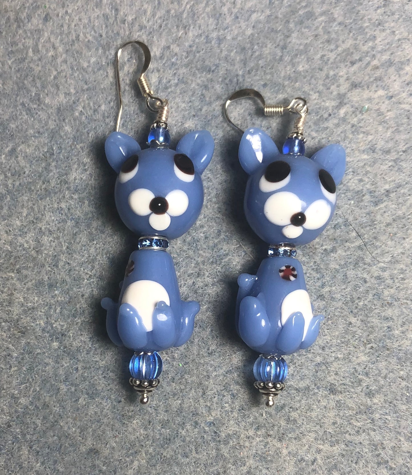 Light blue lamp work two piece cat bead earrings adorned with blue rhinestone “collars” and light blue Czech glass beads.