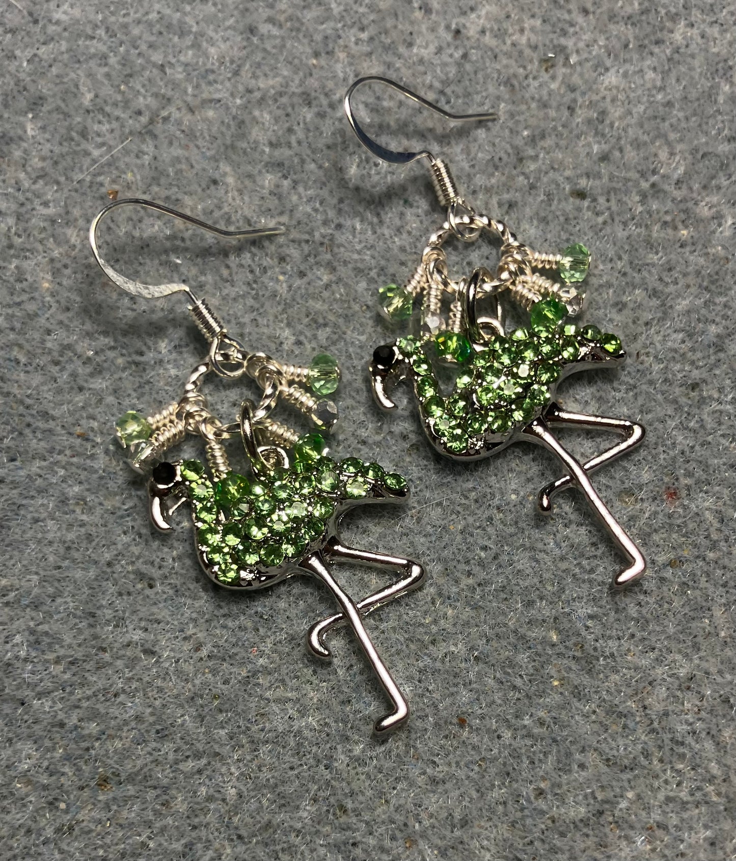 Silver and light green rhinestone flamingo charm earrings adorned with tiny dangling light green and silver Chinese crystal beads.