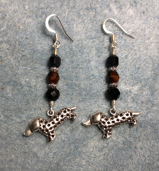 Silver dachshund charm earrings adorned with black and brown Czech glass beads