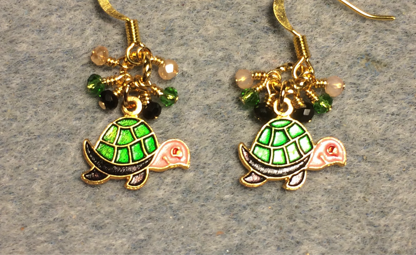 Vintage green, black, and peach enamel turtle charm earrings adorned with tiny dangling green, black, and peach Chinese crystal beads.