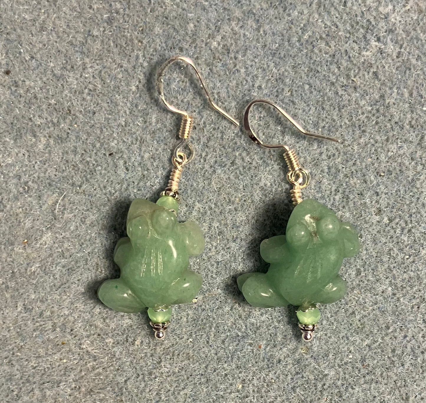 Green aventurine gemstone frog bead earrings adorned with light green Chinese crystal beads.