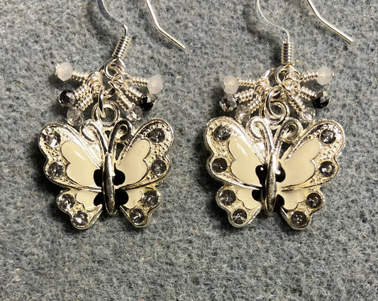 Silver, white, and black enamel and rhinestone butterfly charm earrings adorned with tiny dangling silver, white, and black Chinese crystal beads.