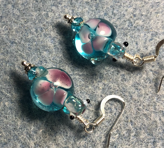 Turquoise and pink lamp work turtle bead earrings adorned with turquoise Chinese crystal beads.