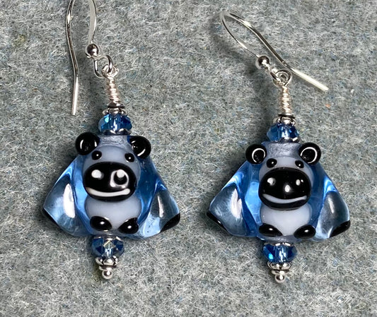 Translucent light blue and black lamp work sheep bead earrings adorned with light blue Chinese crystal beads.