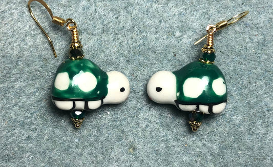 Dark green and white ceramic turtle bead earrings adorned with dark green Chinese crystal beads.