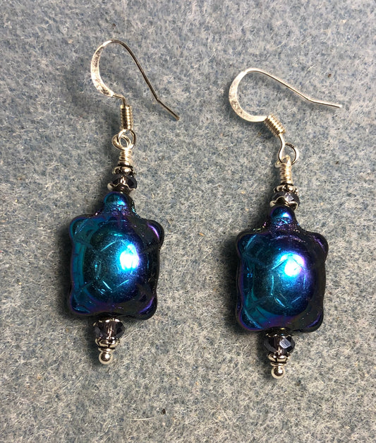 Metallic purple blue Czech glass turtle bead earrings adorned with purple Chinese crystal beads.