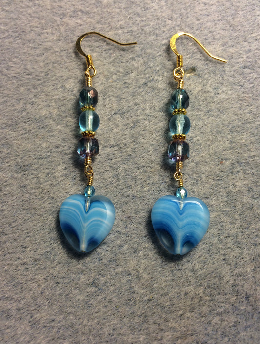 Turquoise Czech glass heart bead earrings adorned with turquoise Czech glass beads.
