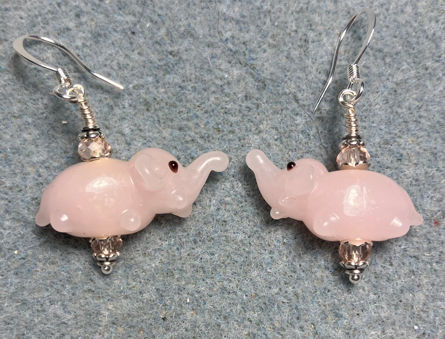 Small pink lamp work elephant bead earrings adorned with pink Chinese crystal beads.