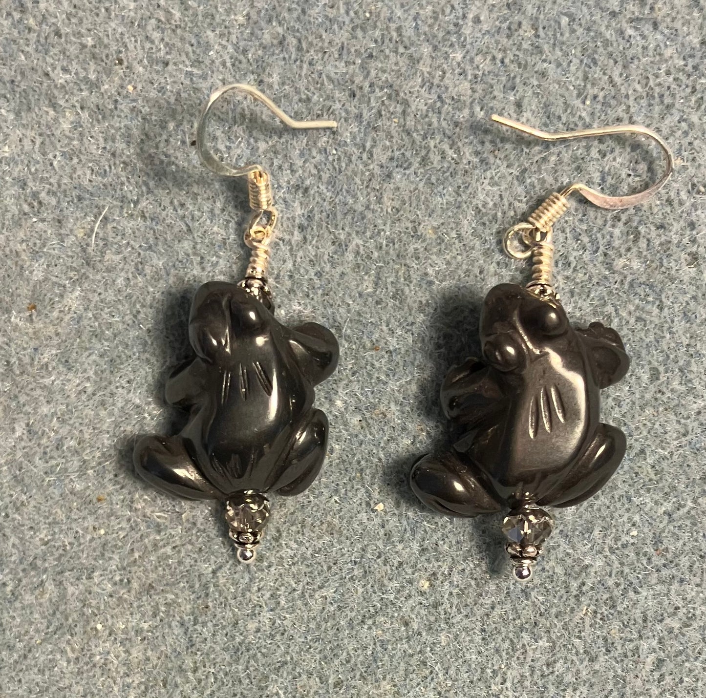 Gray hematite gemstone frog bead earrings adorned with gray Chinese crystal beads.