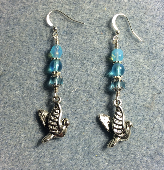 Silver flying dove charm earrings adorned with light turquoise Czech glass beads