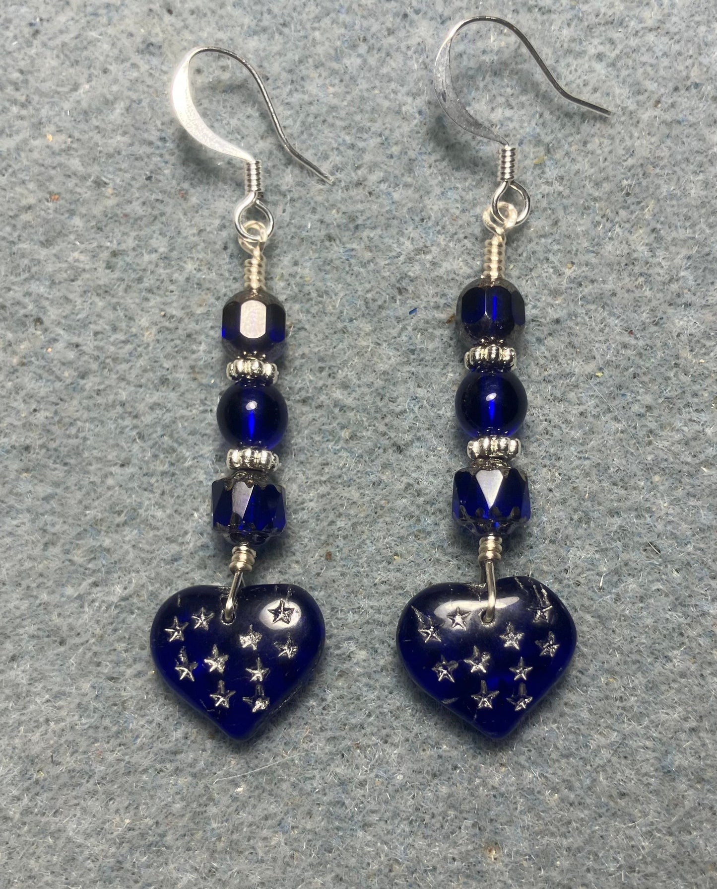 Dark blue Czech glass heart bead earrings adorned with dark blue Czech glass beads.