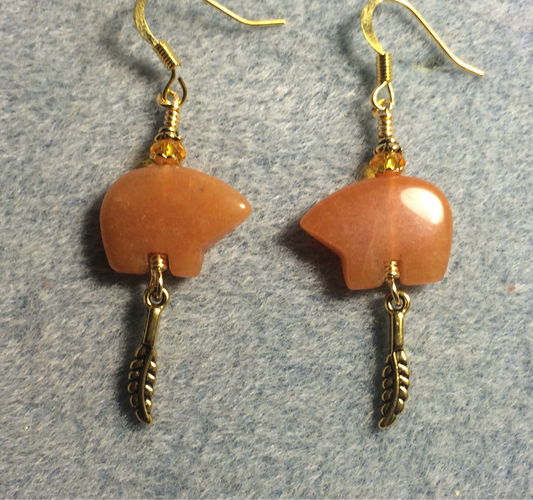 Orange aventurine gemstone Zuni bear fetish bear earrings adorned with orange crystal beads and tiny gold feather charms.