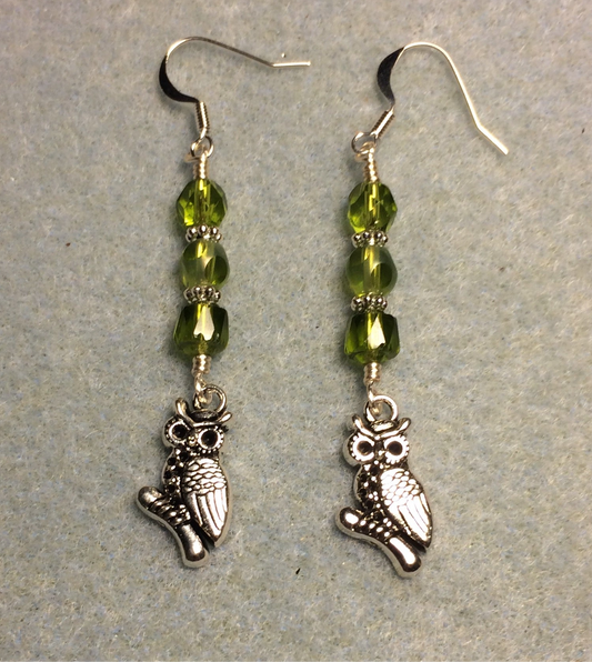 Silver owl charm earrings adorned with olive green Czech glass beads