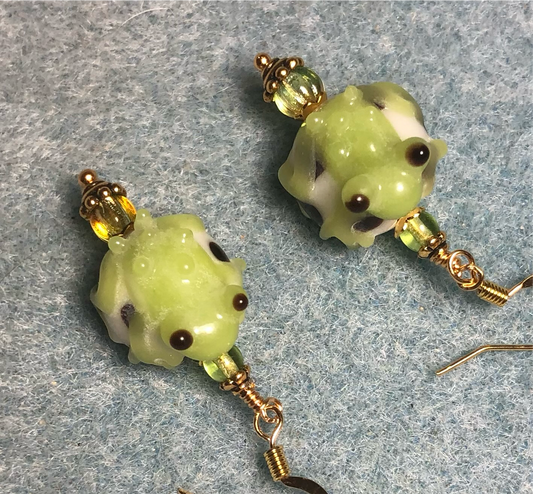 Lime green and white lamp work frog bead earrings adorned with lime green Czech glass beads.