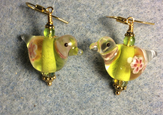 Translucent yellow green lamp work songbird bead earrings adorned with yellow green Czech glass beads.