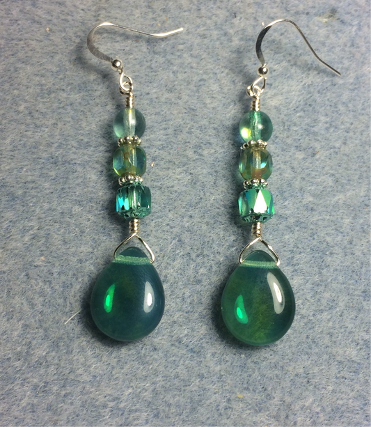 Opal green Czech glass pear drop bead earrings adorned with opal green Czech glass beads.