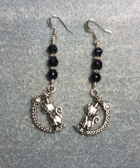 Silver spinning cat charm earrings adorned with grape purple Czech glass beads.