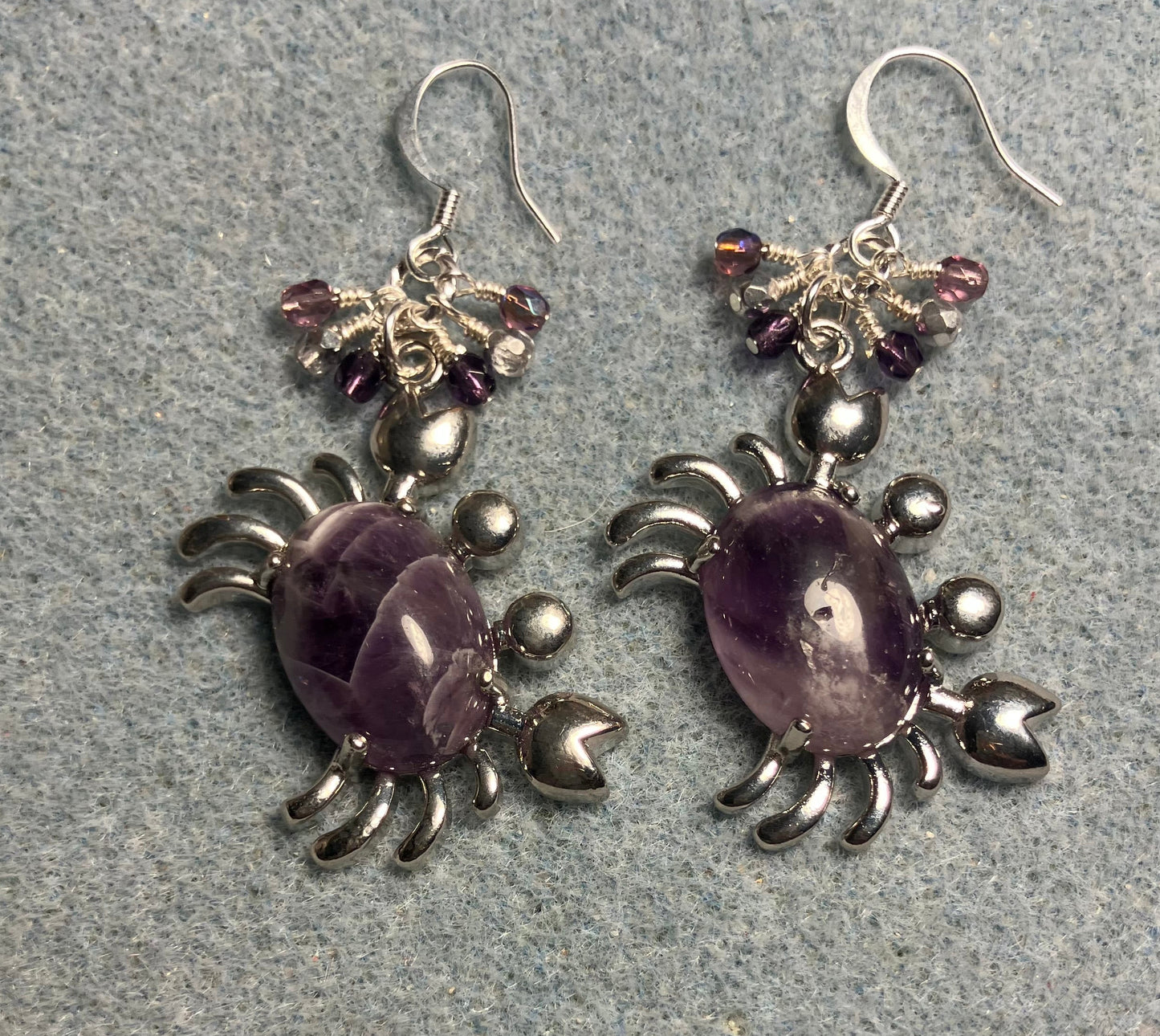 Silver and amethyst gemstone crab charm earrings adorned with small dangling purple and silver Czech glass beads.